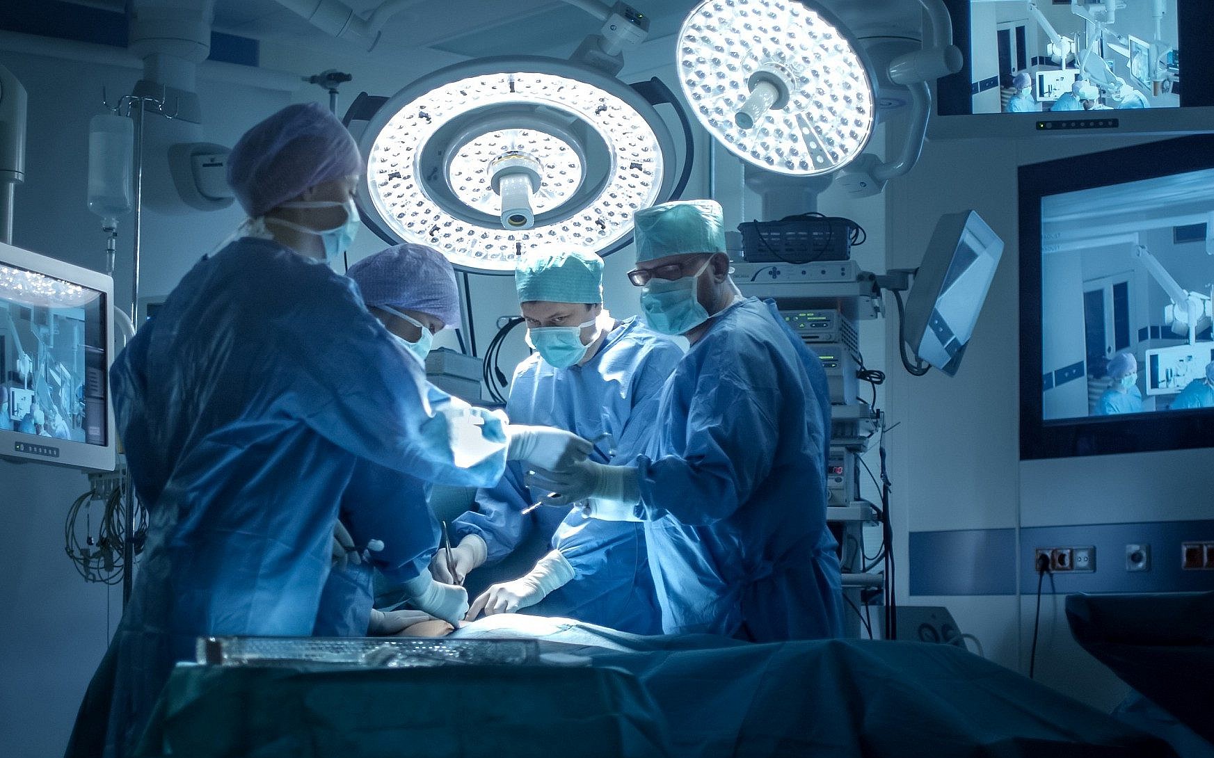 A medical team performs surgery in a state-of-the-art operating room